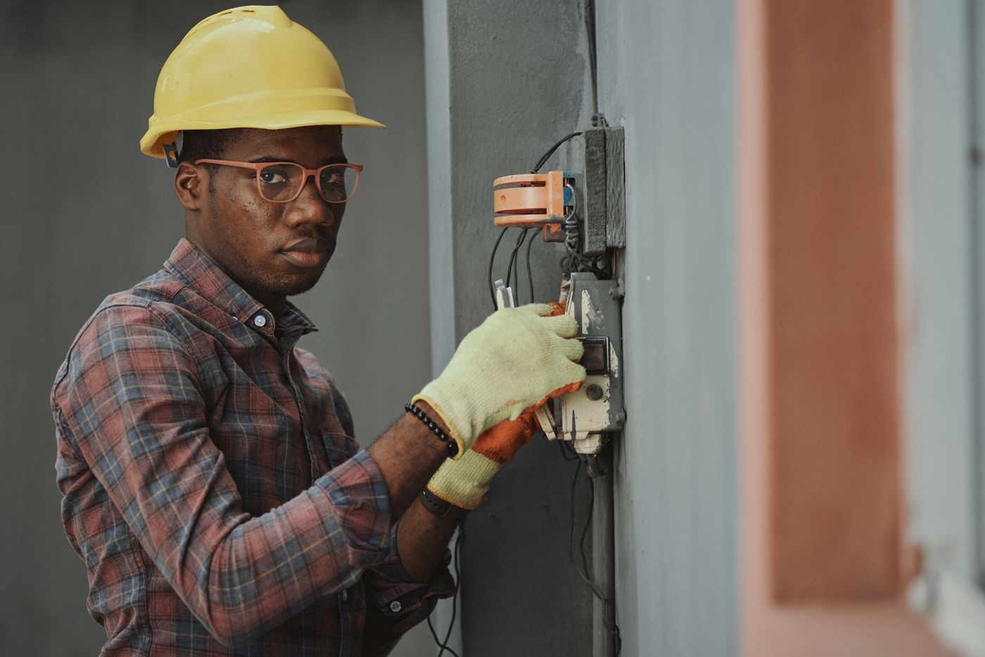 A qualified electrician working on an installation